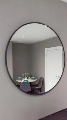 a dining room mirror with a table in a room at Castlemilk Apartment in Glasgow