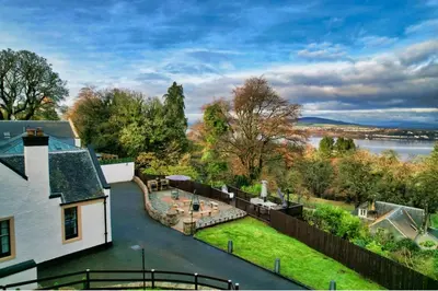 an aerial view of a house with a yard at Gleddoch Coach House in Langbank