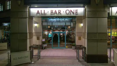 an entrance to a store with a sign that reads all bar one at One Bedroom Flat in Central Edinburgh Old Town , Heart of Edinburgh Flat Sleeps 4 in Edinburgh