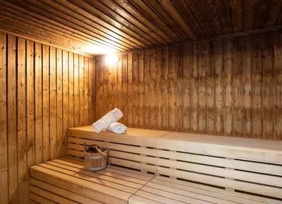 a wooden sauna with a roll of toilet paper in it at Apex Dunblane Hydro in Dunblane