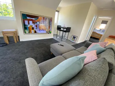a living room with a couch and a table at WHITEHILL STABLES in Kirknewton