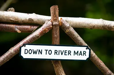 a sign that says down to river marrar at The Mar Huts - The Lomond Hut in Drymen