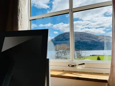a window with a view of a mountain at Avoca House in Fort William