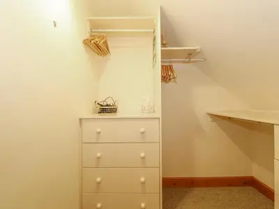 a closet with a white dresser in a room at Glen View in Dumfries