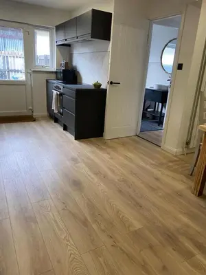 a kitchen with a stove and a counter top at Sleeps7-Parking-Garden-Patio in Johnstone