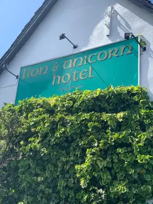 a sign for a hotel on the side of a building at Lion and Unicorn Hotel in Thornhill
