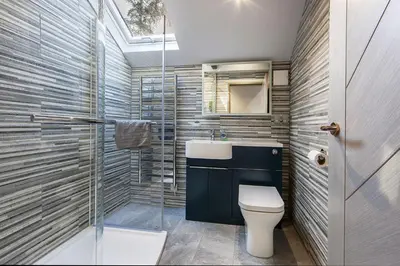 a bathroom with a toilet and a sink and a shower at Dundonald Landing Palms 2 in Oban
