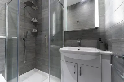 a bathroom with a shower and a sink and a toilet at Ochil View in Stirling