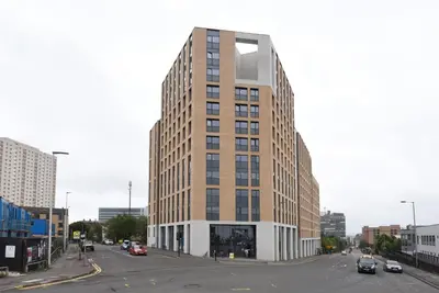 a tall building on a street in a city at Student Only Ensuite Room in Central Glasgow in Glasgow