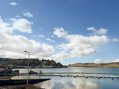a view of a body of water with a pier at Bay View in Oban
