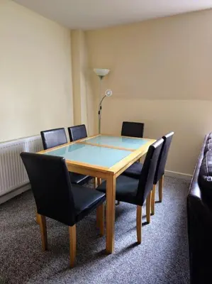 a conference room with a wooden table and chairs at 2 Bedroom Modern stylish Apt in Glasgow City Centre in Glasgow