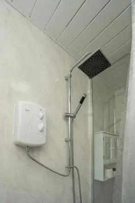a shower in a bathroom with a glass shower stall at Free Parking - 2 Bedroom Flat-by Holiday Homes in Cambusnethan