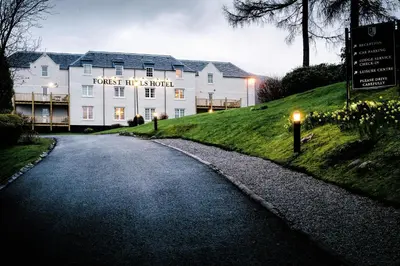 a building on the side of a road at Macdonald Forest Hills Hotel & Spa in Aberfoyle