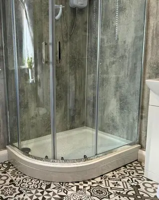a shower with a glass door on a bathroom at Jura in Oban