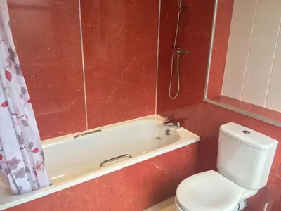 a bathroom with a tub and a toilet and a shower at Adam Drysdale House in Edinburgh