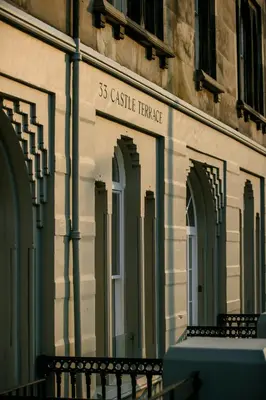 a building with a sign on the side of it at 33 Castle Terrace in Edinburgh