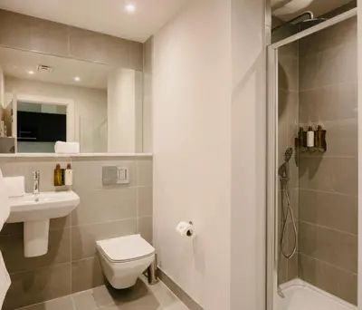 a bathroom with a toilet and a sink and a shower at 33 Castle Terrace in Edinburgh