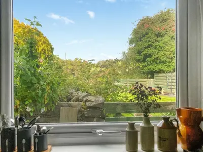 a window with a view of a garden at Darroch in Moniaive