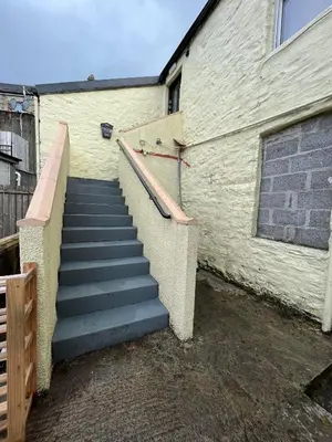 a stairway leading up to a building with a stair case at The Rest in Tarbert