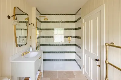 a bathroom with a sink and a walk in shower at Penicuik Estate in Penicuik