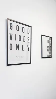 two framed posters hanging on a wall at 1 BDR Apartment By Caledonia Luxe Stays Short Lets & Serviced Accommodation in Dumbarton