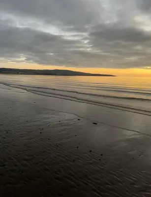 a beach with a cloudy sky and the ocean at No 6, Ayr, 140m2, New Decor 2024, 3bedroom, detached house, with private gardens in Ayr