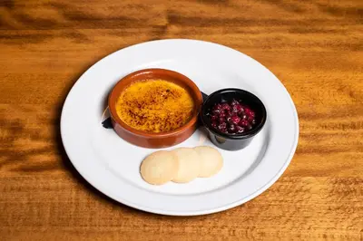 a plate of food with dip and cookies on a table at Green Hotel, a member of Radisson Individuals in Kinross