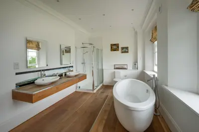 a large white bathroom with two sinks and a tub at Alexander House 24 - Self Catering in Auchterarder