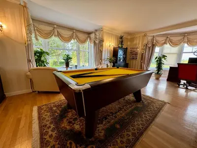 a living room with a pool table in it at FINN VILLAGE - Loch Lomond Villa - THE JUNGLE ROOM with a PRIVATE HOT TUB in Drymen