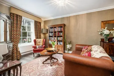 a living room with a couch and a table at Number 10 in Edinburgh