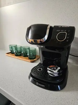 a black coffee maker sitting on a counter at Glebe Apartment in Campbeltown