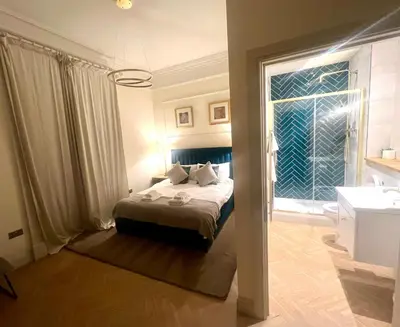 a bedroom with a bed and a large window at 'Gordon' in ApartNest Auchterarder in Auchterarder