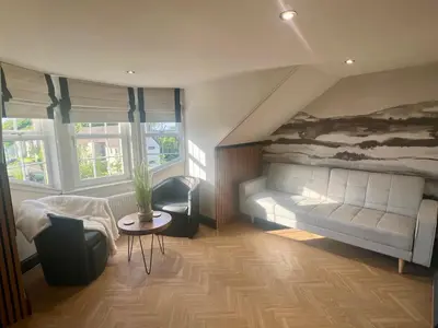 a living room with a couch and a table at 'Clyde' in ApartNest Auchterarder in Auchterarder