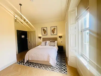 a bedroom with a bed and a window at 'Douglas' in ApartNest Auchterarder in Auchterarder