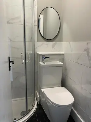 a bathroom with a white toilet and a mirror at West End Cosy Pop of Colour - Pass the Keys in Glasgow