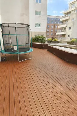 a chair sitting on the roof of a building at KM Granton Apartment in Edinburgh