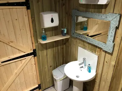 a bathroom with a sink and a mirror at The Bothy and Wagon at Pitmeadow Farm in Perth