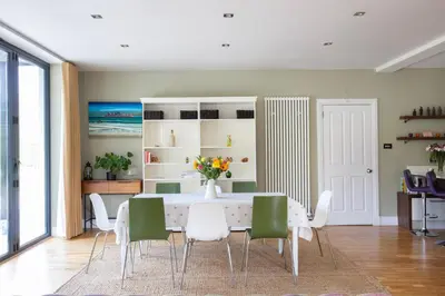 a dining room with a table and chairs at Large and luxurious country home near Glasgow in Eaglesham