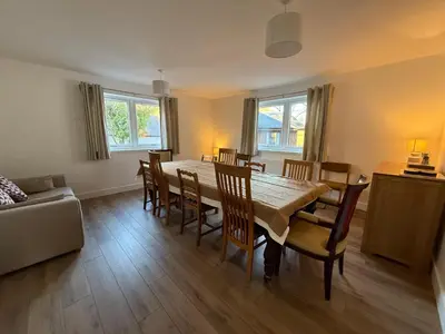 a dining room with a table and chairs at Highland Hideaway in Fort William