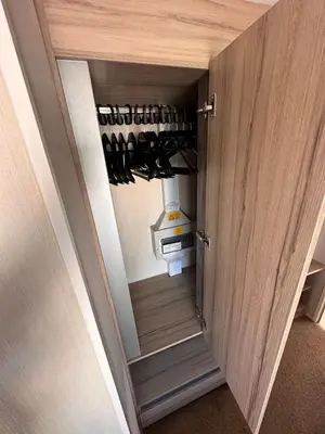 a door open to a wine cellar with wine bottles at Swift 3-Bedroom Caravan Located in Uddingston, Glasgow at Maryville Caravan Site in Uddingston