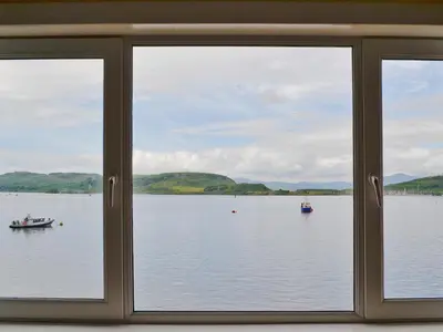 a view of a lake from a window at Seaview in Oban