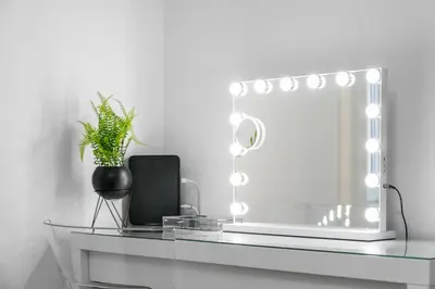 a glass desk with a mirror and a plant on it at Upper Grove 2 Bedroom Apartment - Edinburgh in Edinburgh