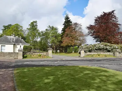 a house with a gate and a driveway at Bracken Log Cabin - S4468 in Glenfarg
