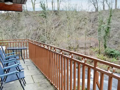 a balcony with chairs and a table on it at The Wheelhouse in Linlithgow