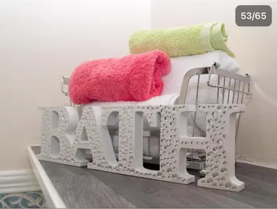 a crib with pillows and a sign that says raw at HLA king court 3 in Motherwell