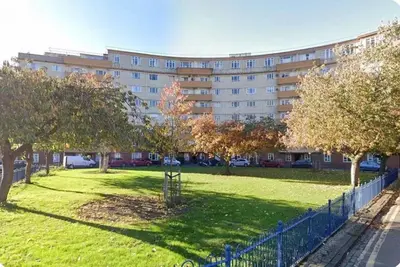 a park in front of a large building at Skyline View Apartment in Edinburgh
