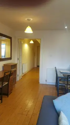 an empty living room with a table and a dining room at Rose Street 2 bedroom in Edinburgh