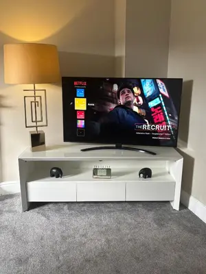 a white entertainment center with a flat screen tv at Golfers Rest in Ayr