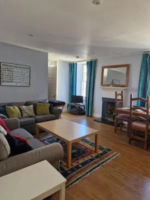 a living room with a couch and a table at Rose Street 4 bedroom in Edinburgh