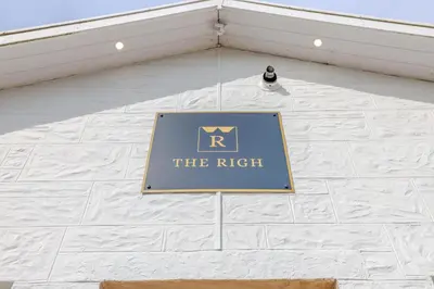 a sign on the side of a white building at The Righ in Oban